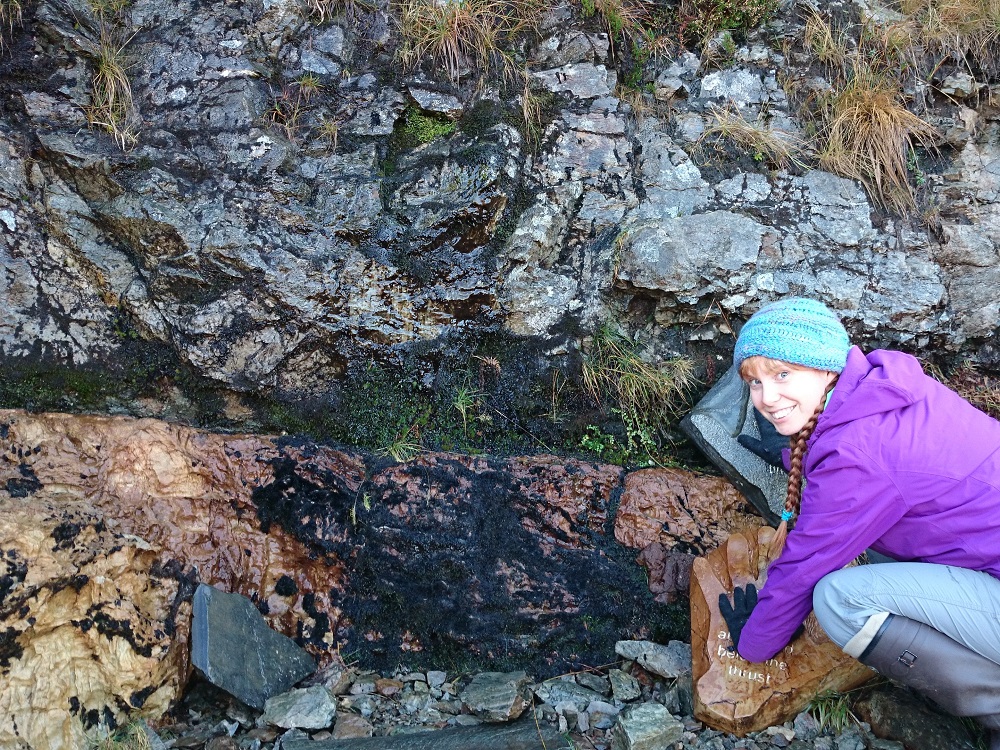 Dr Laura Hamlet places her hands either side of the Moine Thrust.