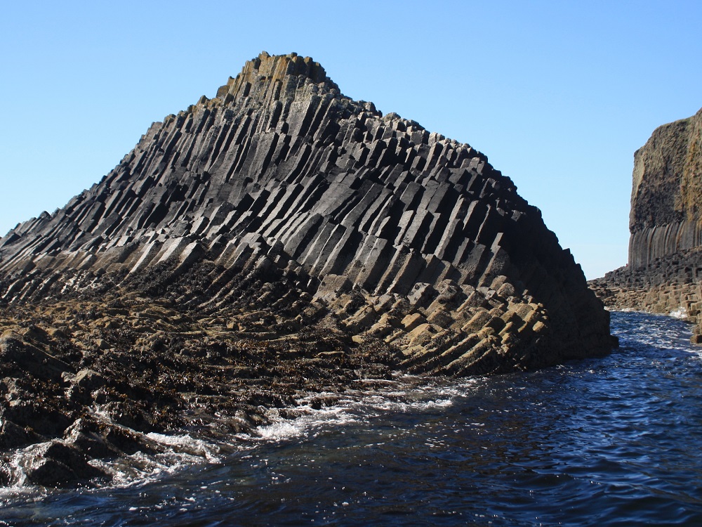 The small islet of Am Buachaille just to the east of Staffa showing curved columns.