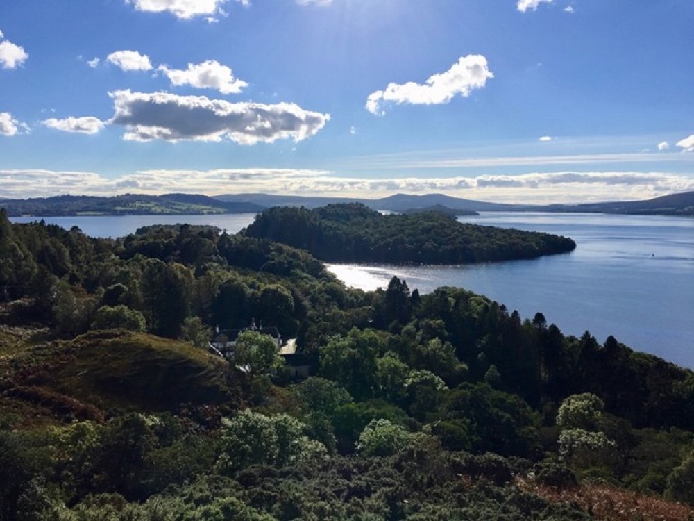 Loch Lomond and Inchcailloch island from above The Old Manse, Conic Hill. Taken facing west, standing on Highland Border Complex serpentine breccia.