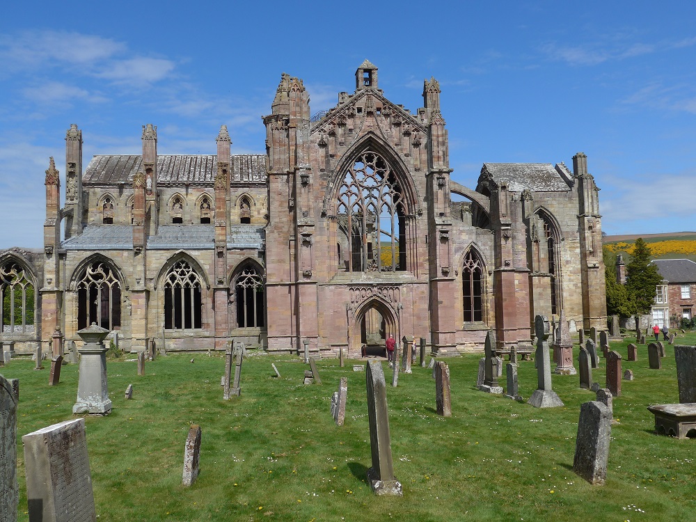 Melrose Abbey: 14th century nave and south transcept walls constructed of local Devonian pink and cream sandstone; earlier parts of the Abbey (e.g.12th century cloister) used greenish grey agglomerate from Chiefswood Quarry.